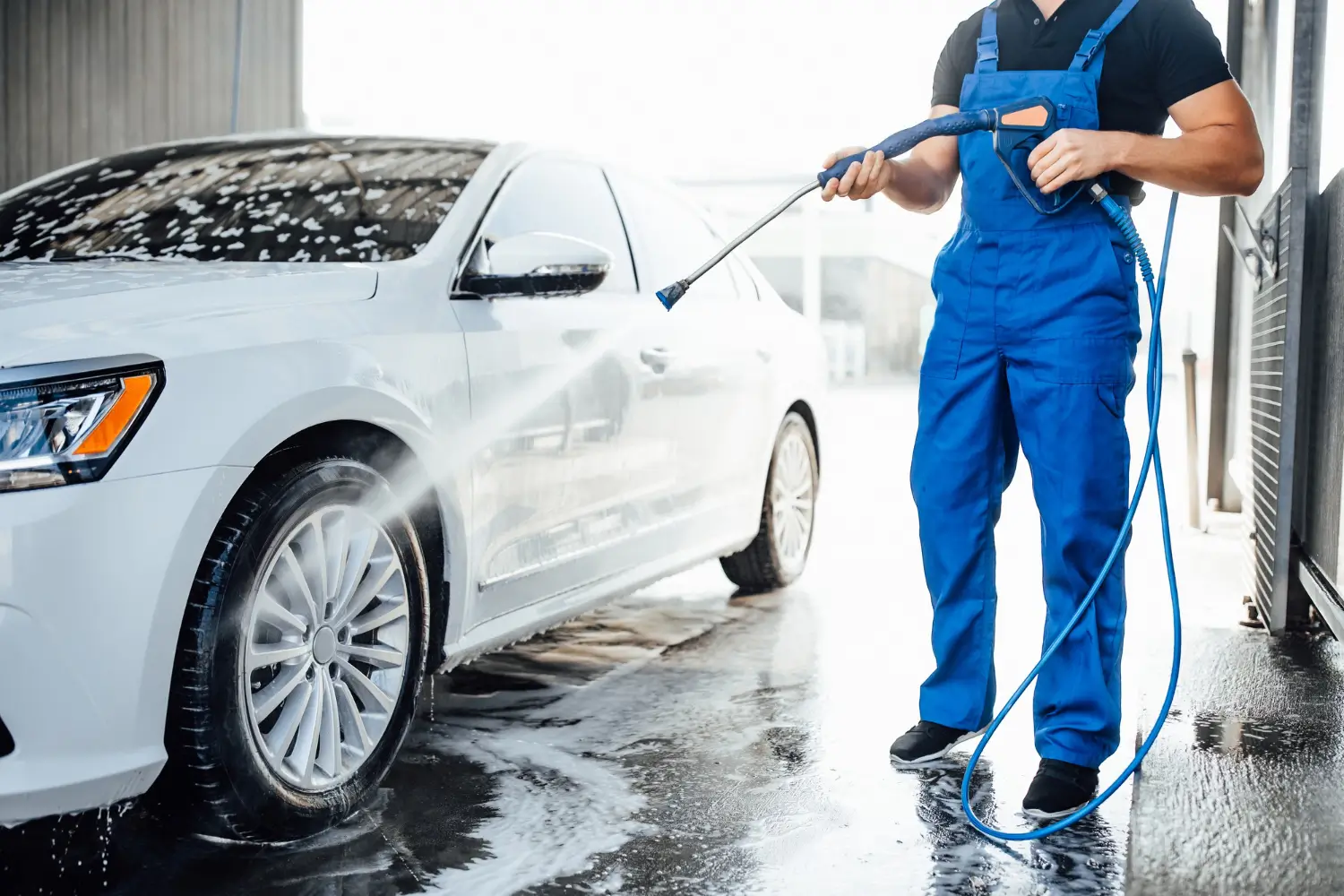 Professional car being washed with premium service at ParkPilot facility